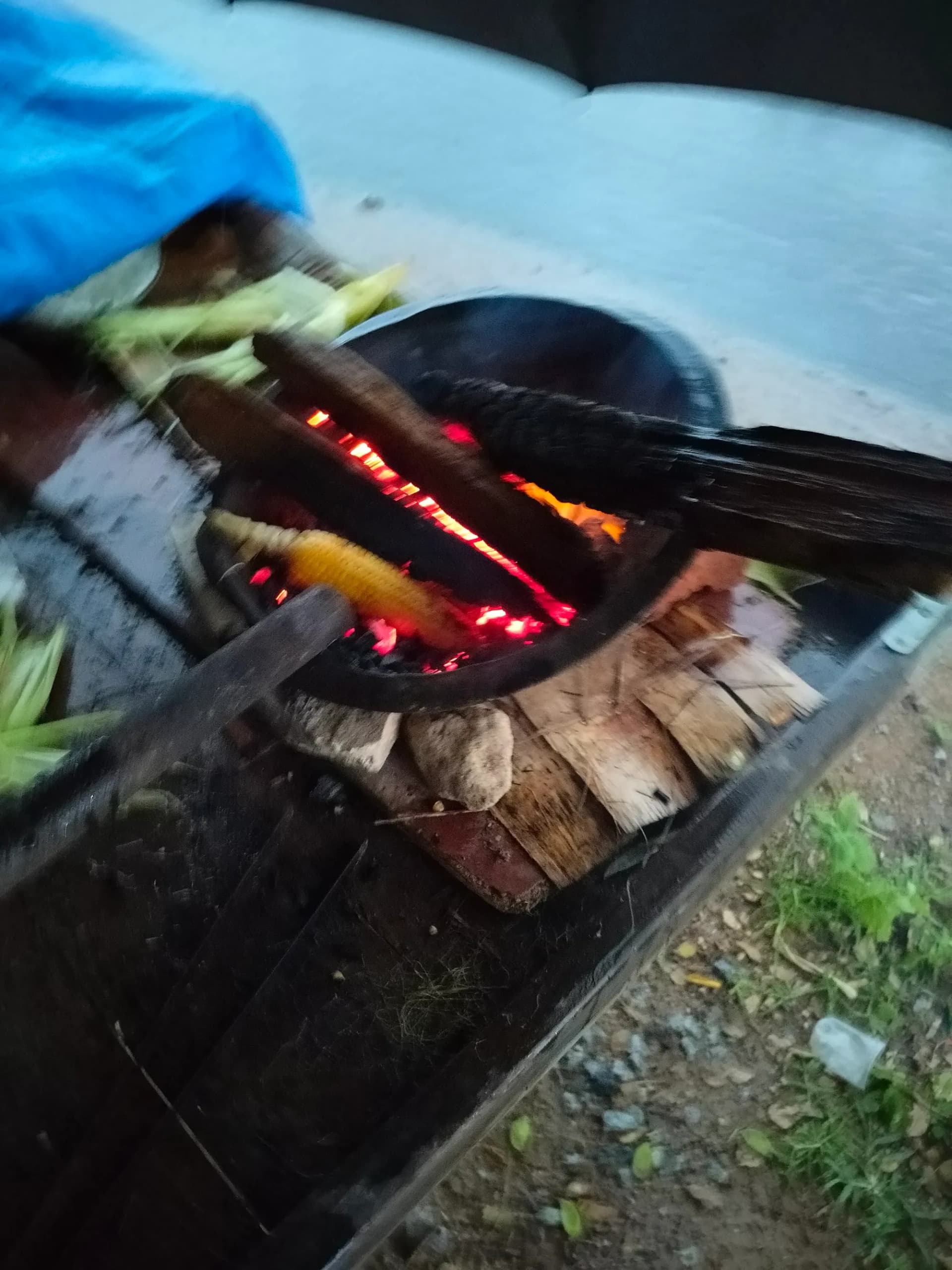 Corn roasting on street-side charcoal